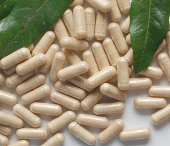 Pure organic triphala capsules with green leaves by SoilSaga Naturals